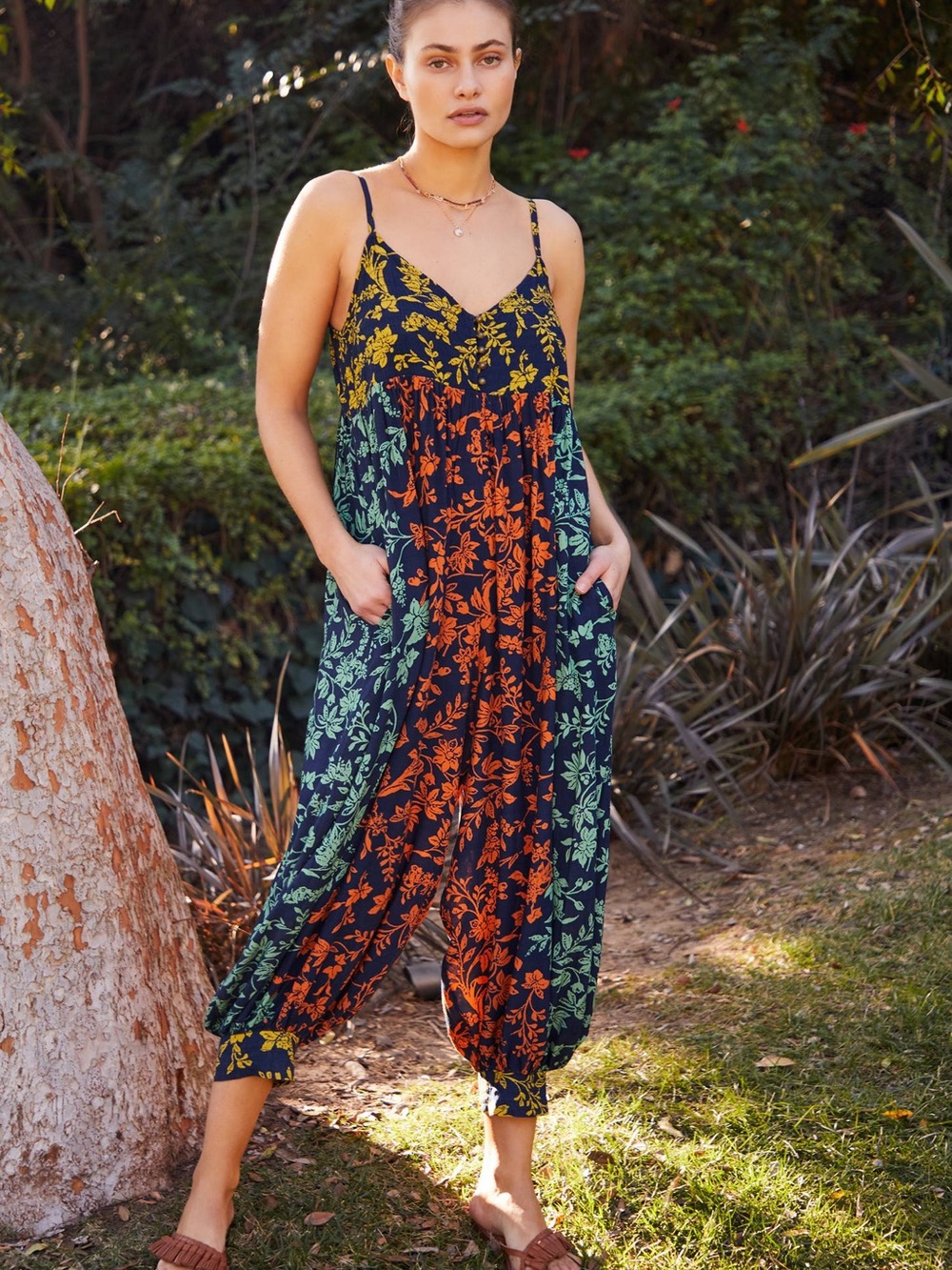 Anthropologie Navy jumpsuit with Green & Rust Floral Print